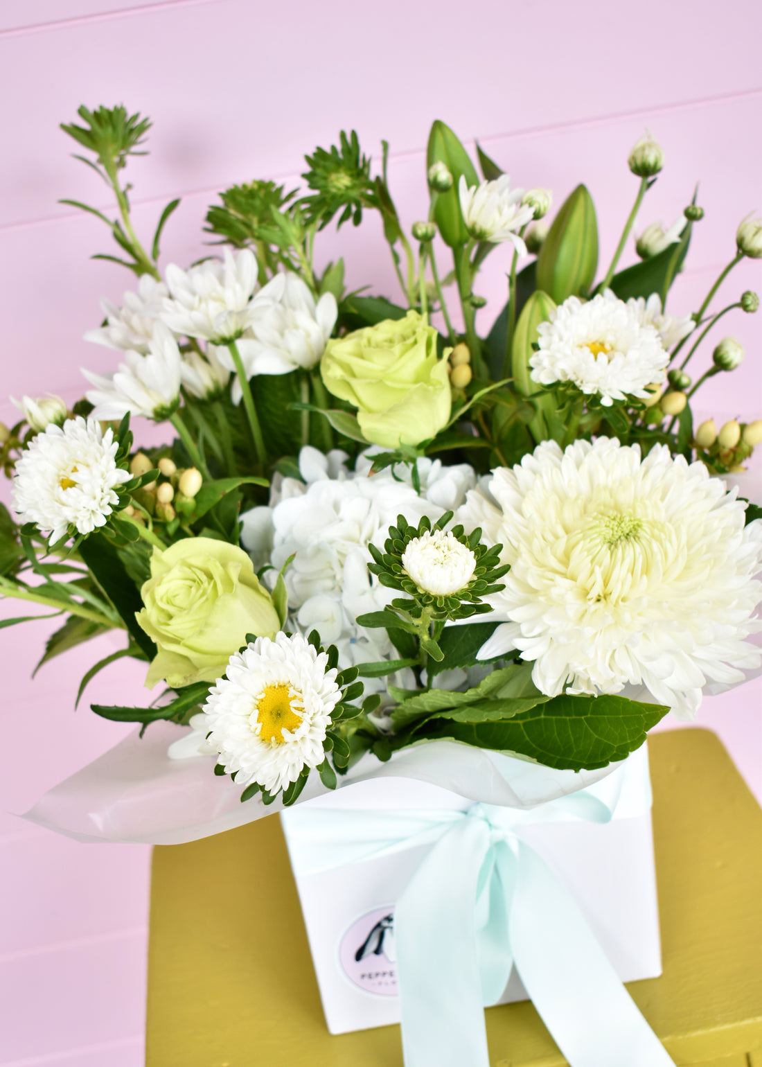 White &amp; green fresh flowers in a white box. Roses, chrysanthemums and hydrangea