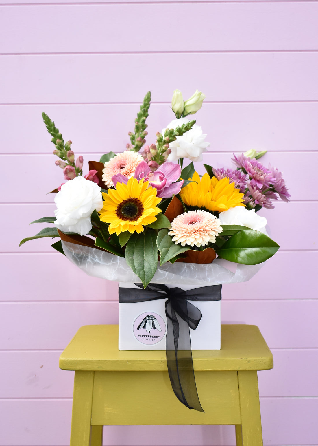 Fresh flower arrangement in a white florist&