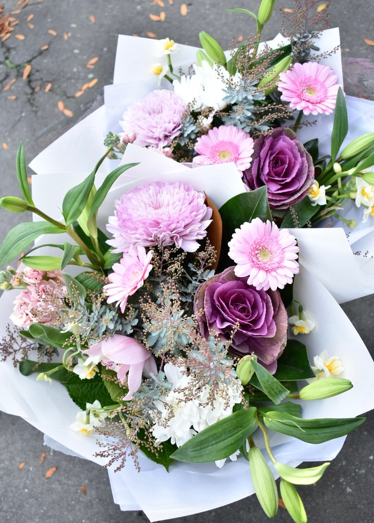 Pretty pale purple, pink and white flower bouquets. Lillies, gerberas and chrysanthemums