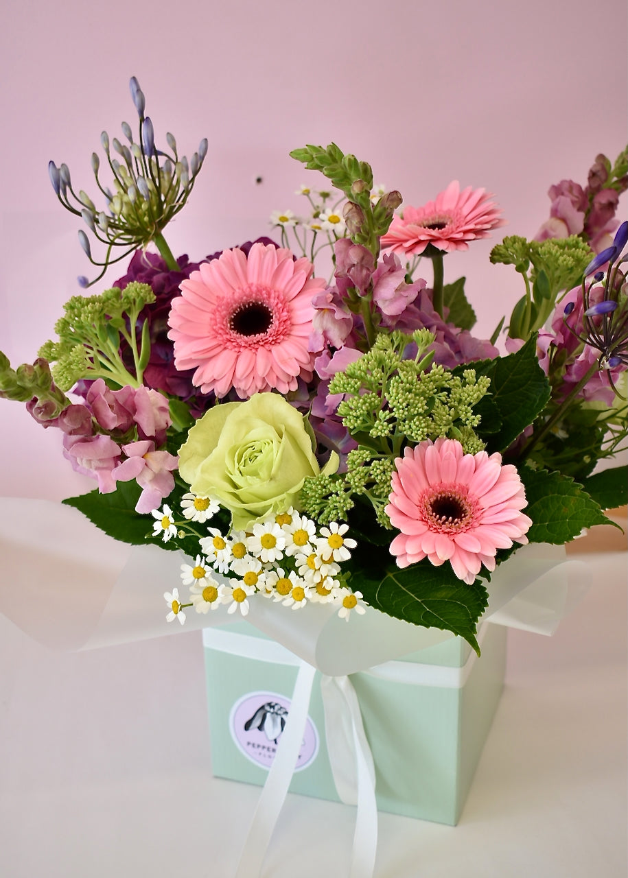 Florist designed bloom box with soft pastel flowers, delivered fresh in Christchurch
