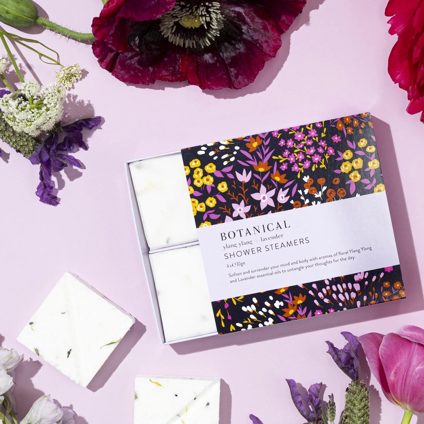 Flat lay of a floral box of shower steamers. Ylang Ylang and lavender aromatherapy.