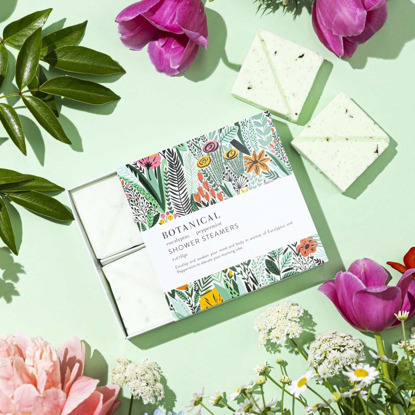 Flat lay of a pretty floral box of peppermint shower steamers.