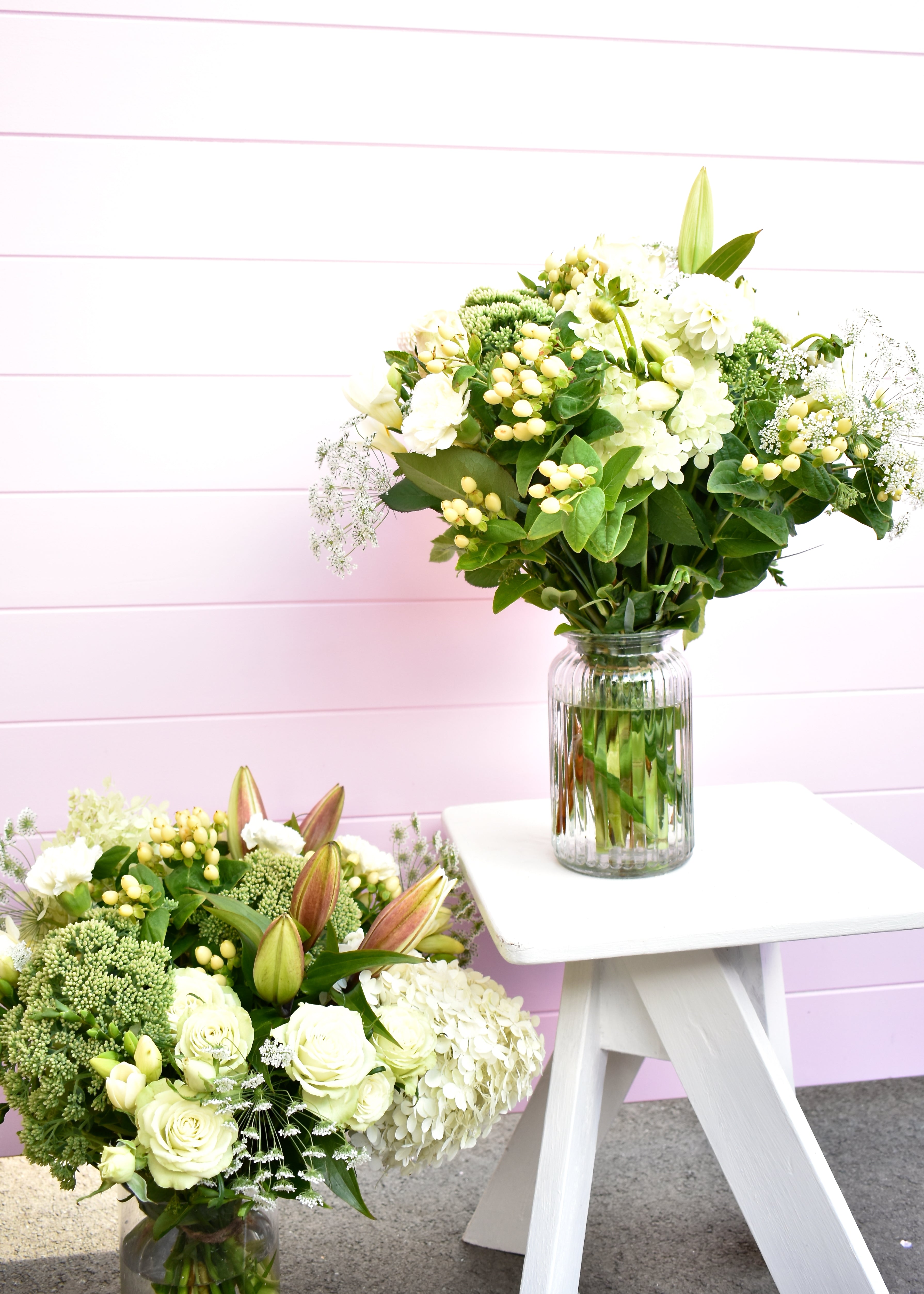 White and green seasonal bouquet in a glass vase hand-tied with fresh cream and green flowers, available for Christchurch flower delivery.