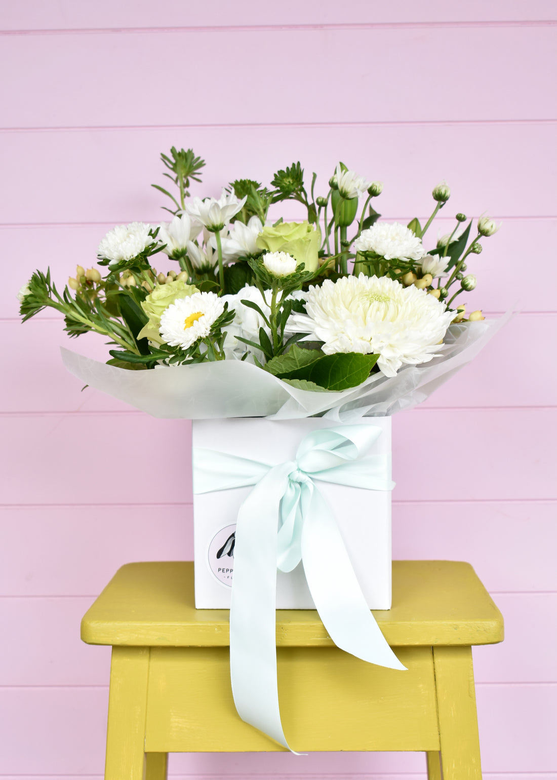 White &amp; green fresh flowers in a white box. Roses, chrysanthemums and hydrangea