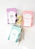 Three boxes of hebal tea in flat lay> Mint, rose and luxe Grey