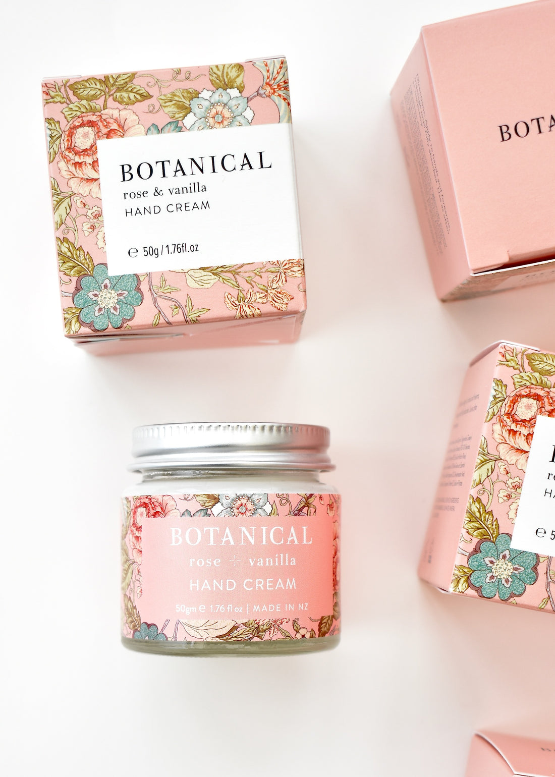 Small pale pink boxes containing jar of rose &amp; vanilla handcream