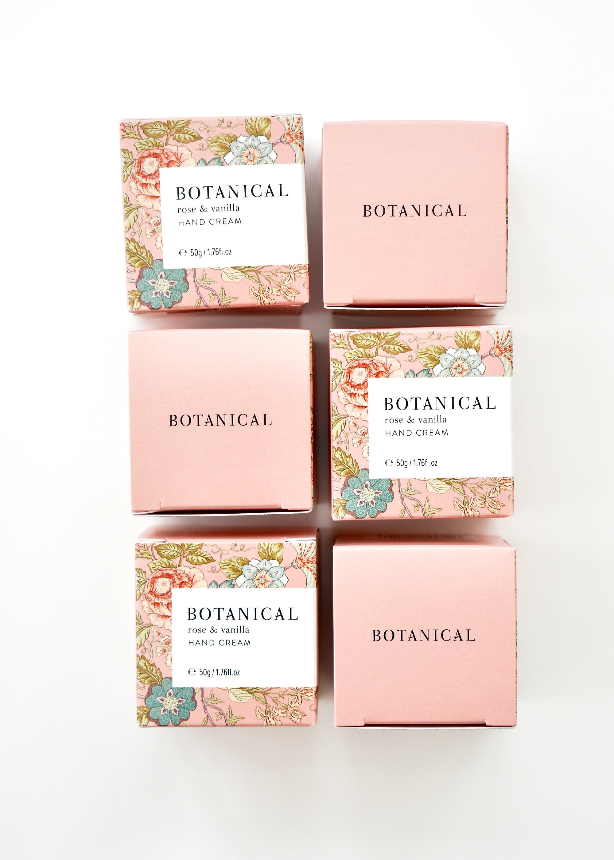 Pale pink floral boxes containing a jar of rose &amp; vanilla hand cream