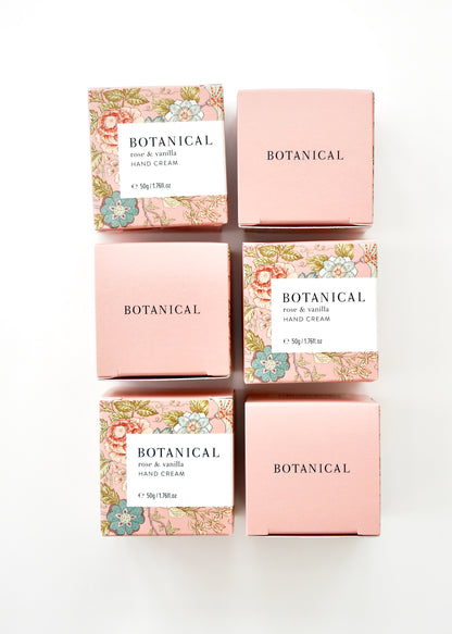 Pale pink floral boxes containing a jar of rose &amp; vanilla hand cream