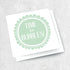 A white greeting card with a pale green hand painted circle on it. Text that reads &